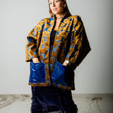 CAPPOTTO KOMOREBI BLU CON OCCHI DORATI CON TASCHE A CONTRASTO BLU