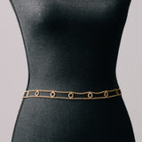 Cinturina gioiello con cerchi di strass bianchi su base dorata
